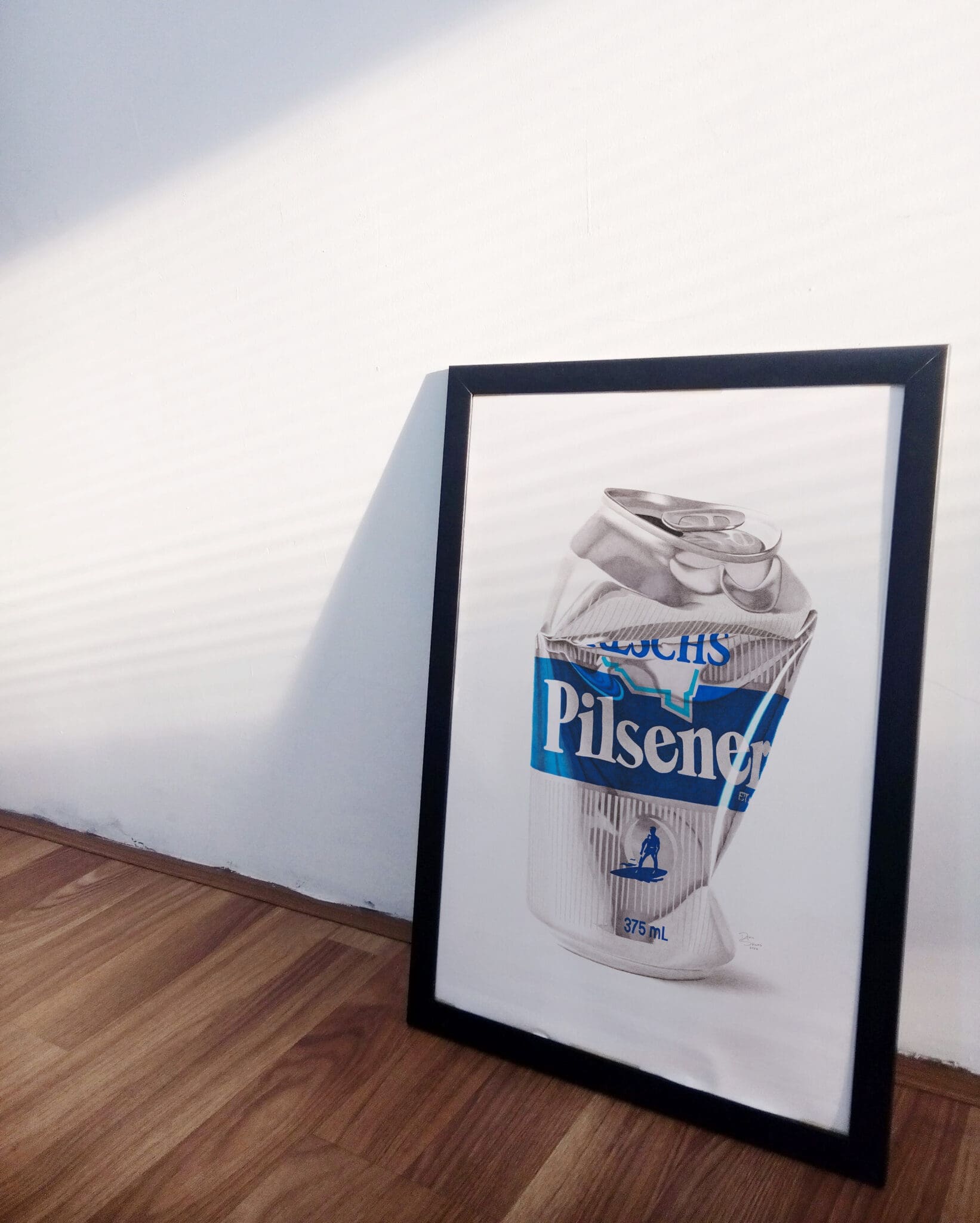 Reschs Pilsener crushed beer can artwork framed print leaning against a wall