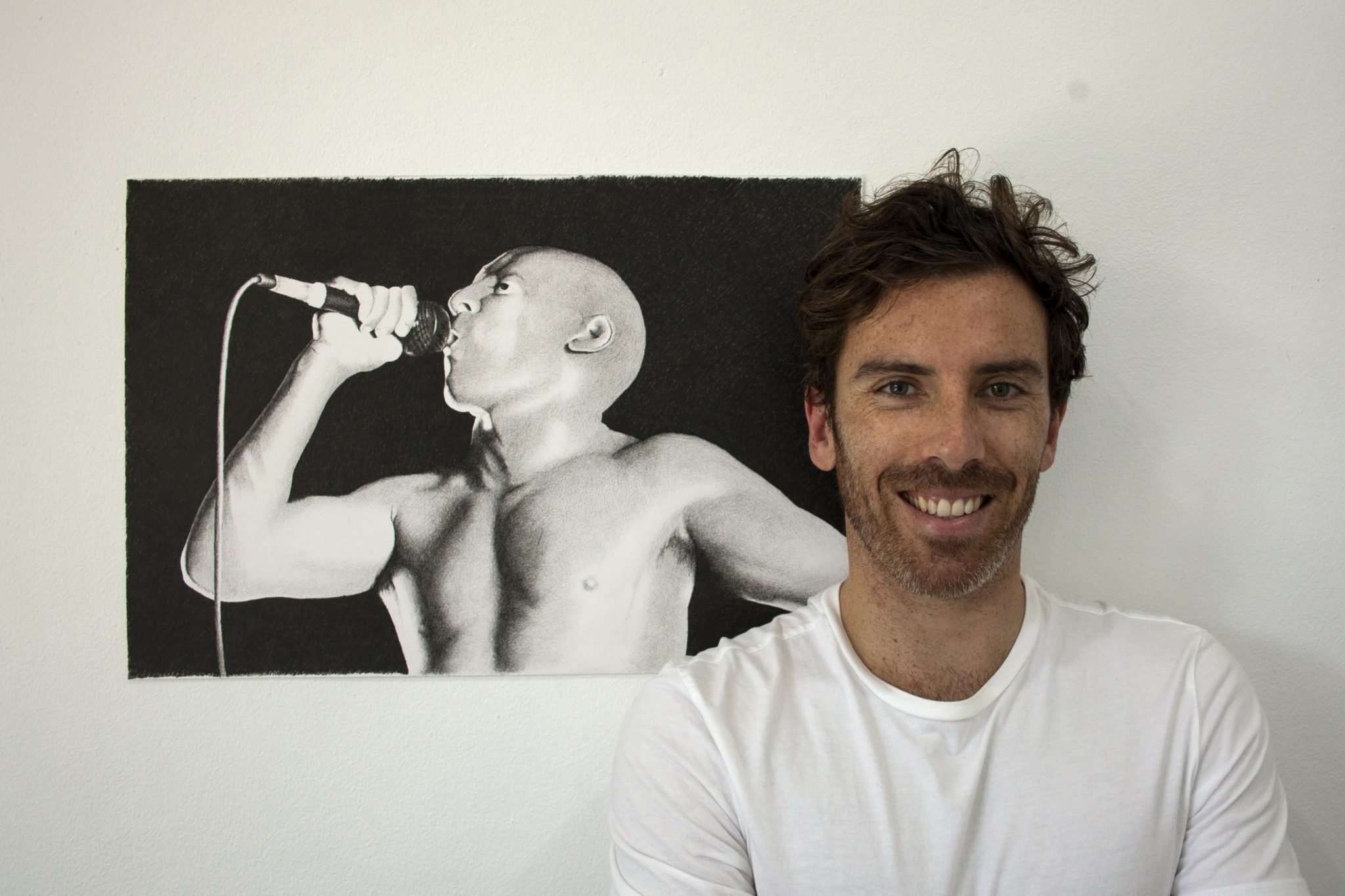 Artist Dean Spinks with his portrait of Maynard James Keenan