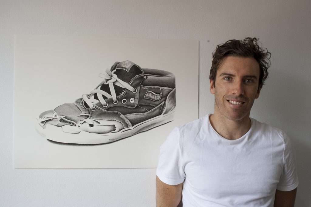 Artist Dean Spinks with his Vans shoe drawing