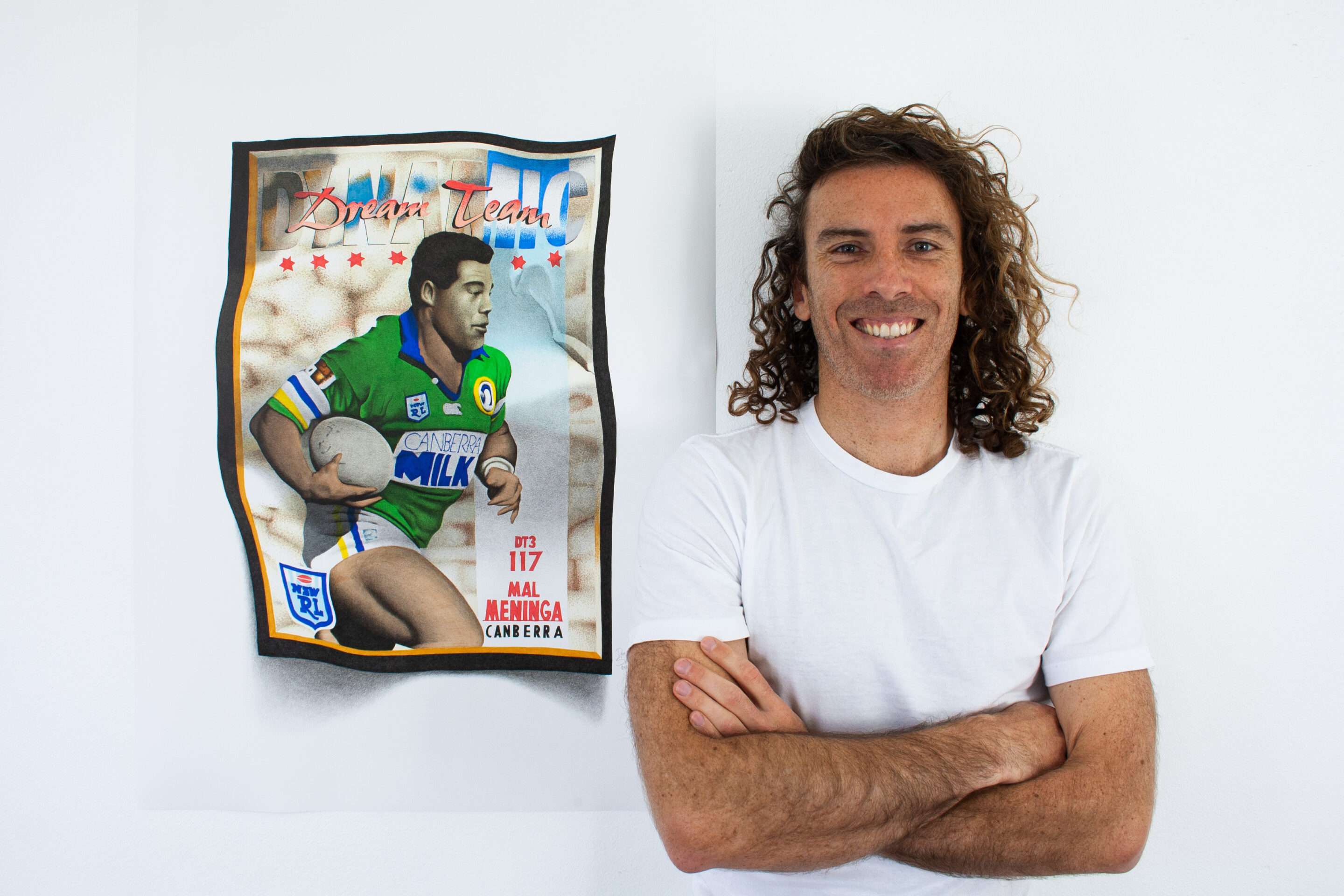 Artist Dean Spinks with his Mal Meninga Rugby League card photorealistic drawing