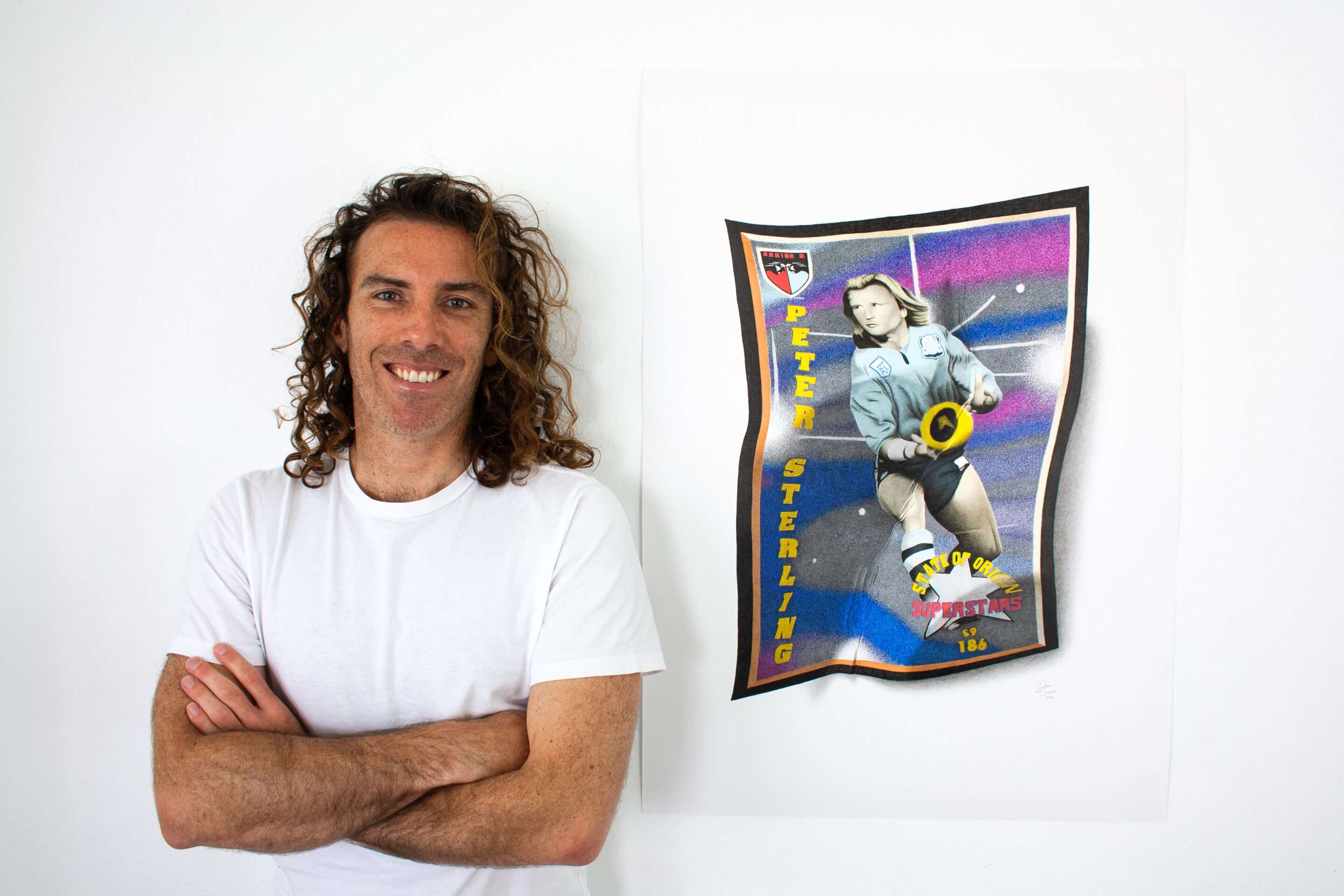 Artist Dean Spinks with his drawing of Peter Sterling's State of Origin Rugby League card