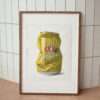 XXXX beer can artwork in frame leaning against wall